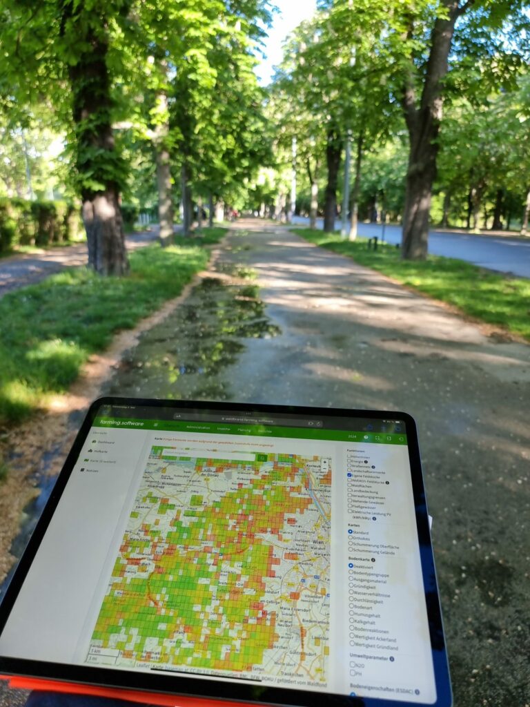 in the park on a sunny day with lots of trees and tablet with prototype