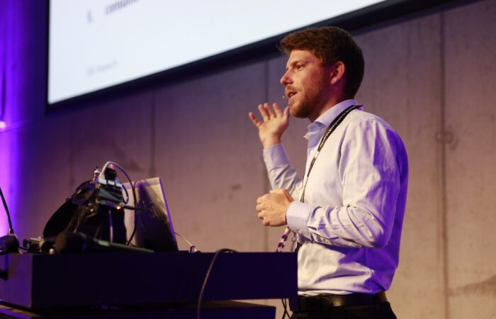 man presenting on stage